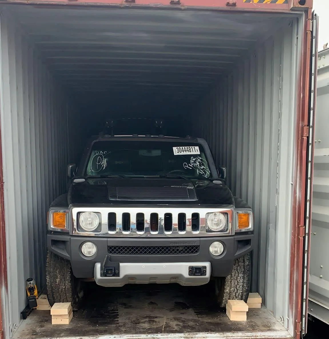 Company SUV secured inside an ocean container